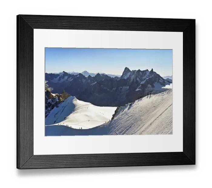 Framed Print : Mountaineers climb over a snow-covered mountain ridge Framed Print : Mountaineers climb over a snow-covered mountain ridge
