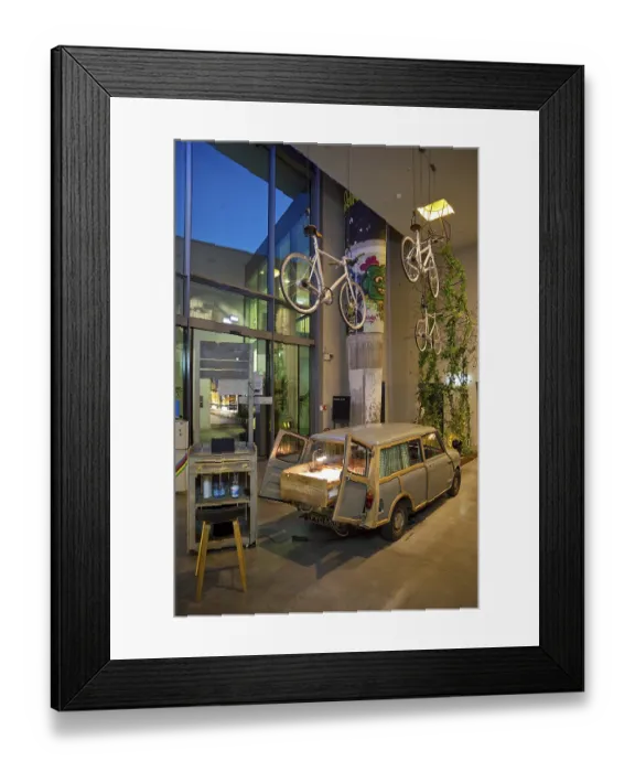 Framed Print : Entrance area to Monkey Bar with old Trabi in the evening