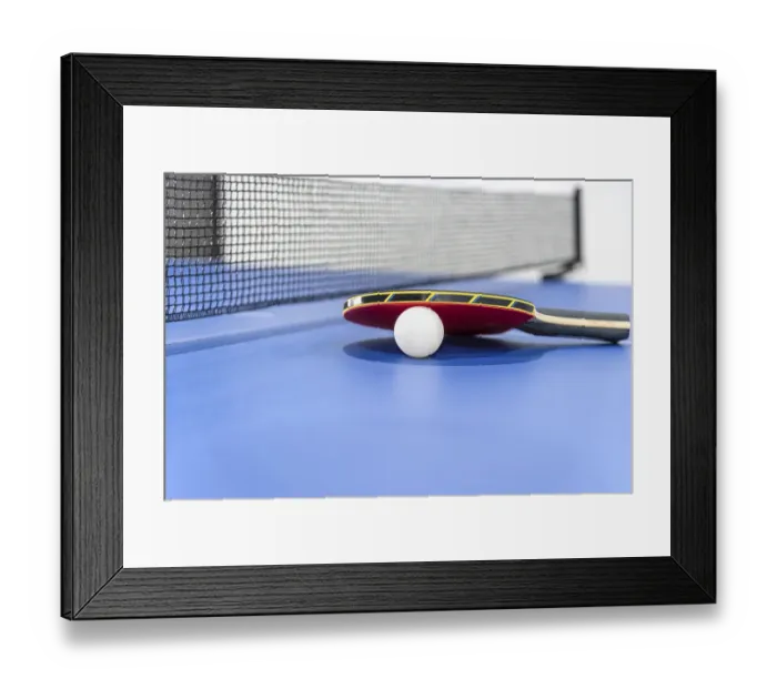 Framed Print : Closeup red table tennis racket and a white ball on the blue ping pong table with a black net