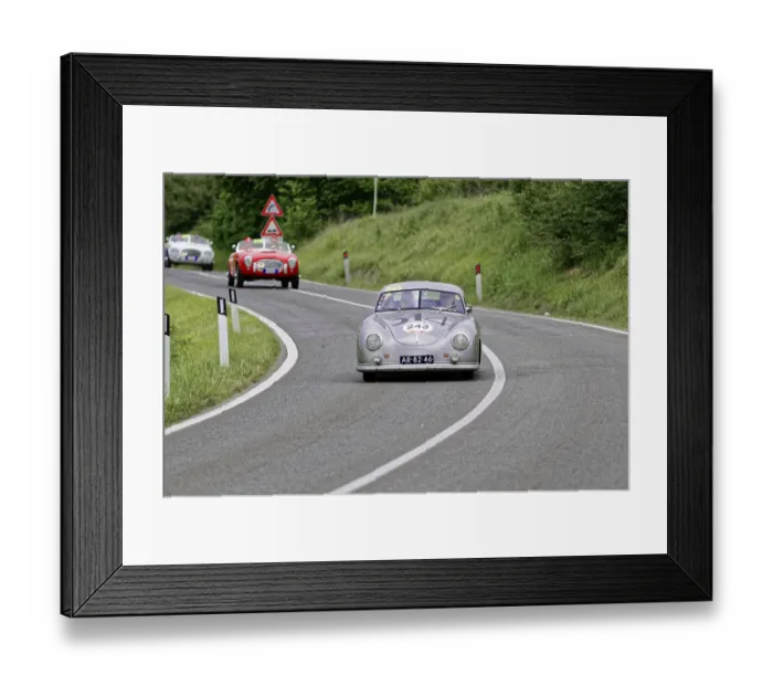 Framed Print : Silver-grey vintage car with racing number on a winding country road