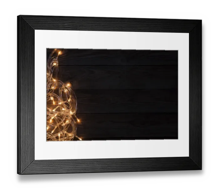Framed Print : Festoon night on empty wooden brown background