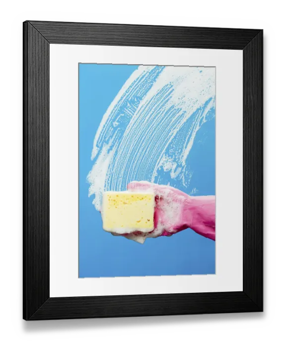 Framed Print : Professional window cleaner with sponge on blue background