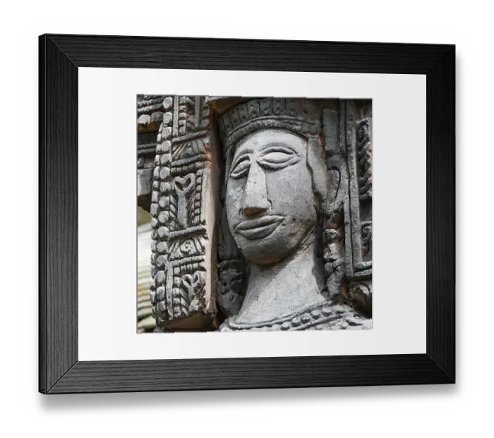 Framed Print : Close up shot of stone statue of a woman with a smiling face