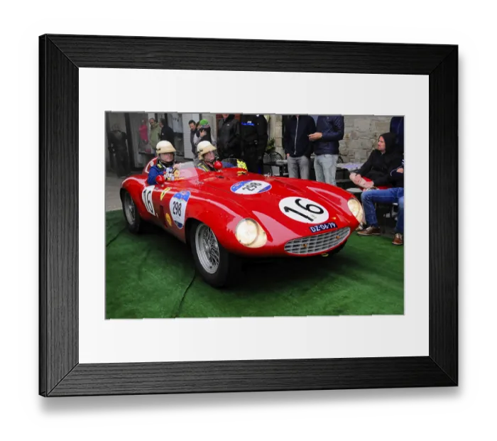 Framed Print : Red racing barchetta with start number 16 glides across the green carpet Framed Print : Red racing barchetta with start number 16 glides across the green carpet