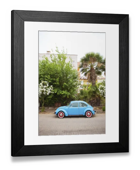 Framed Print : A blue Volkswagen Beetle is parked in a beautiful location
