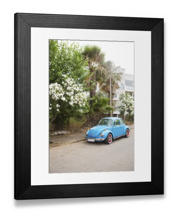 Framed Print : Blue Volkswagen beetle parked in a beautiful area