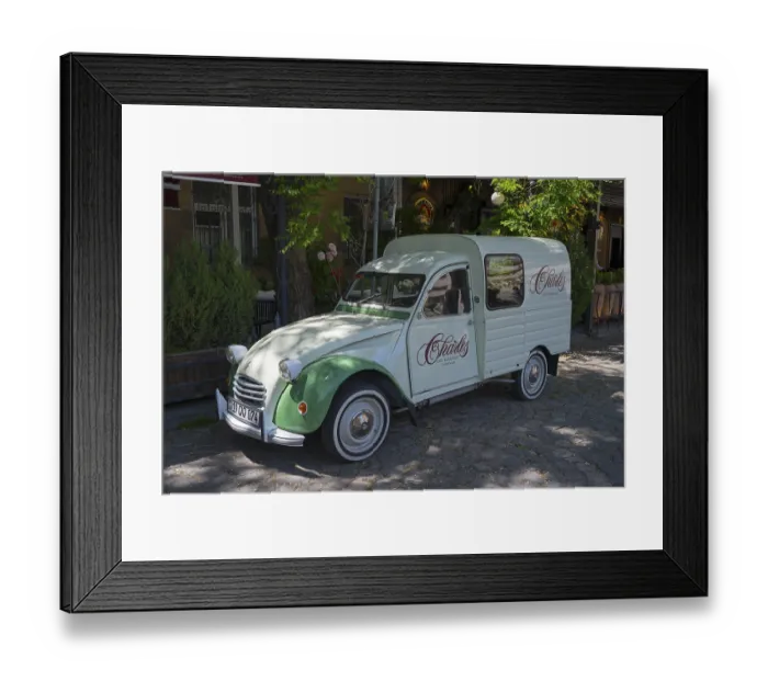 Framed Print : Retro-colored Citroen car parked in shady area under trees