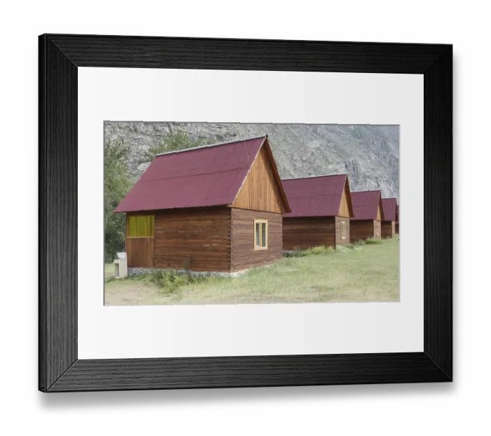 Framed Print : Wooden camping cabins near mountains