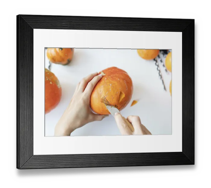 Framed Print : Halloween October 31st. The step-by-step process of carving a pumpkin
