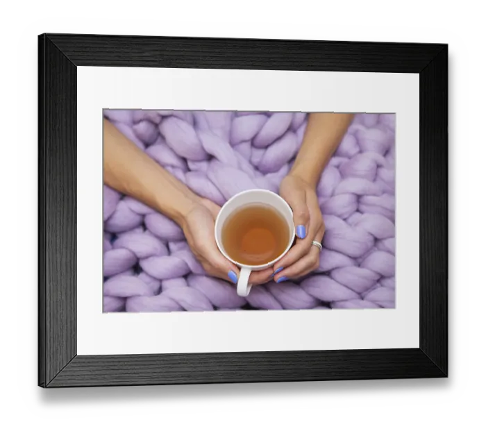 Framed Print : A girl wrapped in a large pink merino wool blanket