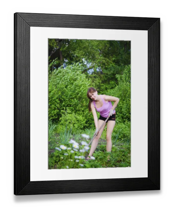 Framed Print : Young happy woman working in the garden