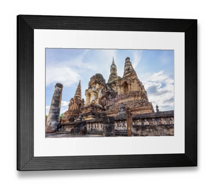 Framed Print : Ancient brick chapel under the blue sky at Wat Maha That temple in Sukhothai Historical Park is an old capital Framed Print : Ancient brick chapel under the blue sky at Wat Maha That temple in Sukhothai Historical Park is an old capital