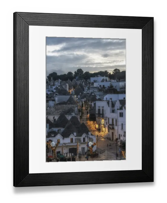 Framed Print : Sunset light over Trulli houses with conical roofs in Alberobello Italy