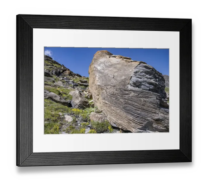 Framed Print : Large rock in the foreground shows fascinating rock structures under a blue sky Framed Print : Large rock in the foreground shows fascinating rock structures under a blue sky