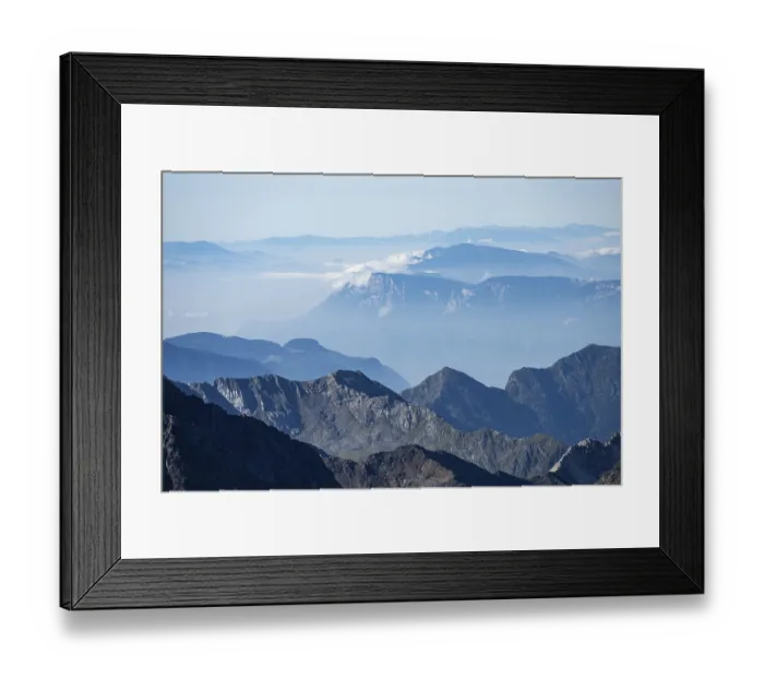 Framed Print : Blurred mountains in fog against a clear blue sky offer tranquil views Framed Print : Blurred mountains in fog against a clear blue sky offer tranquil views