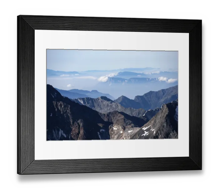 Framed Print : Rocky mountain landscape with snow-capped peaks and clear views