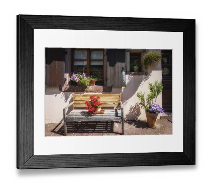Framed Print : Flowers in a small vase on a bench in Colmar street Framed Print : Flowers in a small vase on a bench in Colmar street