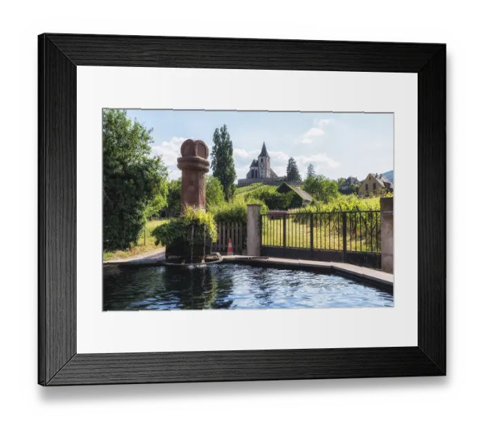 Framed Print : Hunawihr saint hune fountain and old fortified church surrounded by vineyards