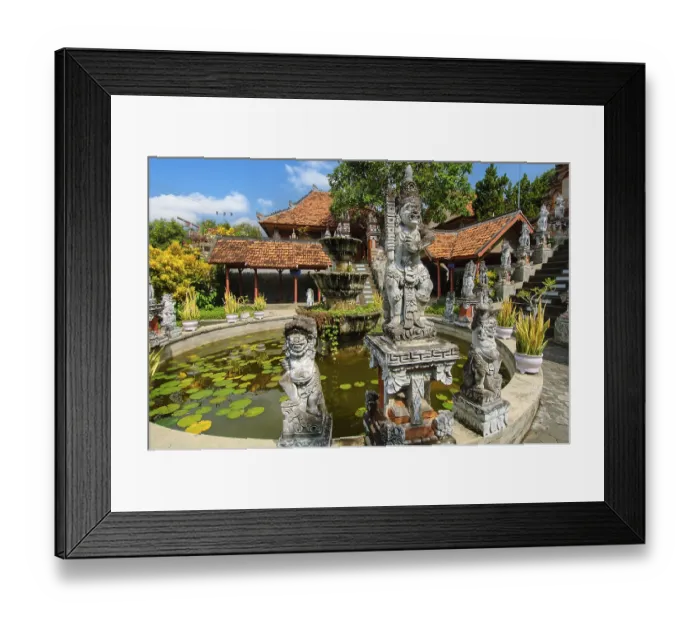Framed Print : Guardian figures in front of an old well in Brahma Vihara Arama Buddha Banjar Buddhist monastery