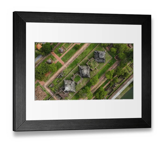 Framed Print : An ancient temple complex next to a city and a modern temple