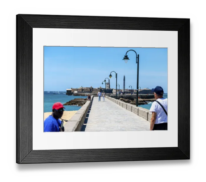 Framed Print : Cadiz, Cadiz - Spain - 05-06-2024: People walking on the long pier of Cadiz