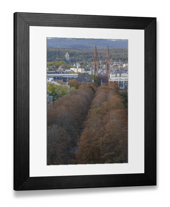 Framed Print : Autumn tree-lined avenue in a city with neo-Gothic towers in the background