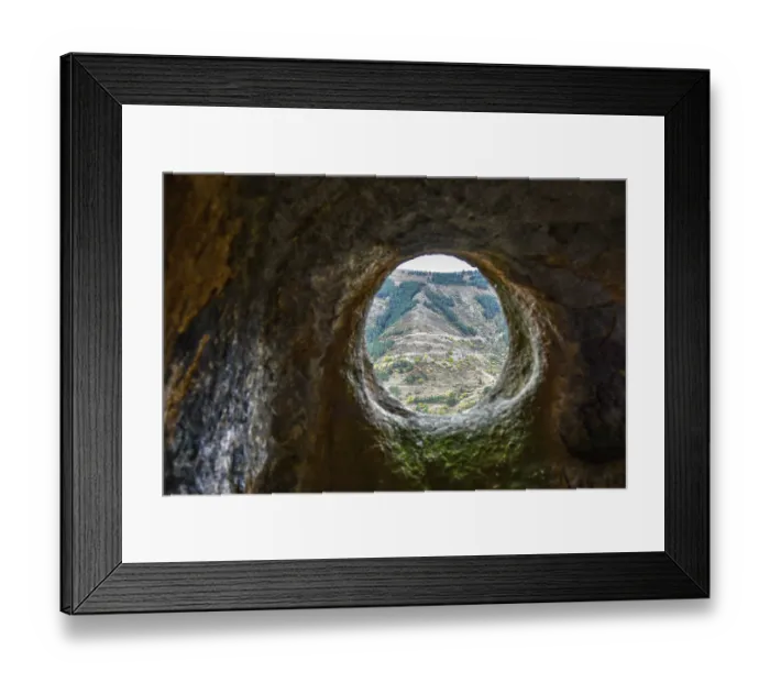 Framed Print : A window in a sandstone cave with a view of the opposite mountain