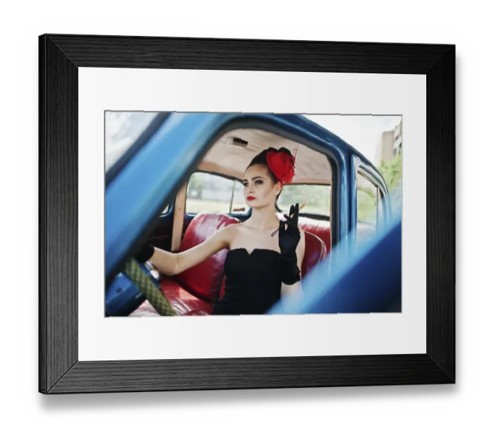 Framed Print : Portrait of beautiful sexy fashion girl model with bright makeup in retro style sitting in vintage car with a cigarette