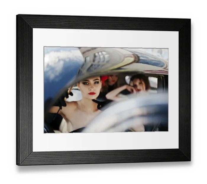 Framed Print : Three young girl in retro style dress seat on old classic vintage car