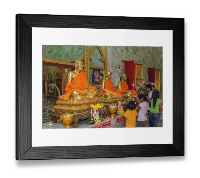 Framed Print : Buddhist believers Buddhists pray making offerings to statues of Buddhist monks covered with gold leaf at Wat Chalong Framed Print : Buddhist believers Buddhists pray making offerings to statues of Buddhist monks covered with gold leaf at Wat Chalong