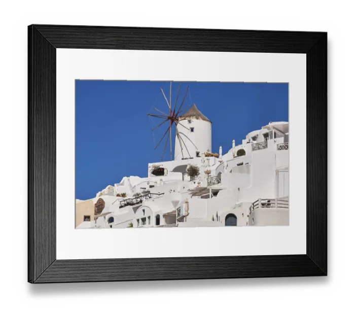 Framed Print : Beautiful panorama view from the old castle of Oia village with traditional white houses Framed Print : Beautiful panorama view from the old castle of Oia village with traditional white houses