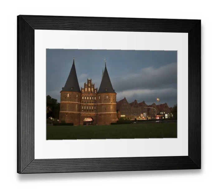 Framed Print : LUBECK, GERMANY - AUGUST 3, 2016: Holstentor Gate during twilight Framed Print : LUBECK, GERMANY - AUGUST 3, 2016: Holstentor Gate during twilight