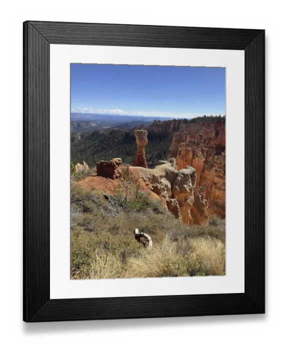 Framed Print : Sublime red stone pillars surrounded by green vegetation and sweeping views across the countryside Framed Print : Sublime red stone pillars surrounded by green vegetation and sweeping views across the countryside