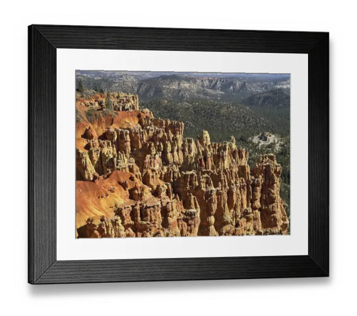 Framed Print : Close-up of textured red rock walls and sweeping views across green valleys Framed Print : Close-up of textured red rock walls and sweeping views across green valleys