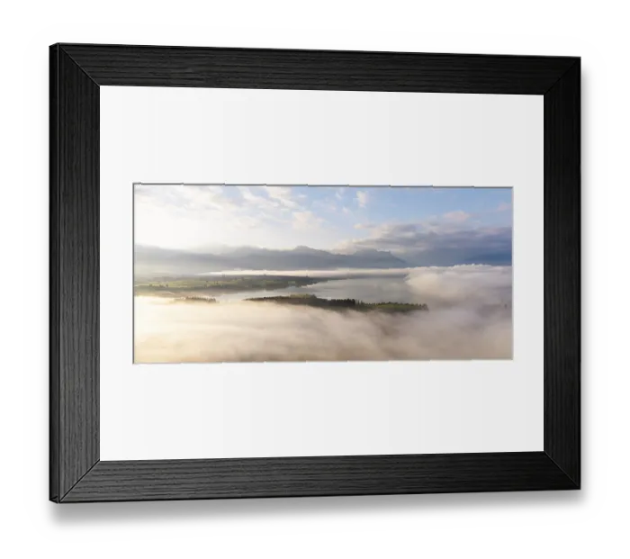 Framed Print : Foggy landscape with view of Lake Forggensee and mountain skyline in the background