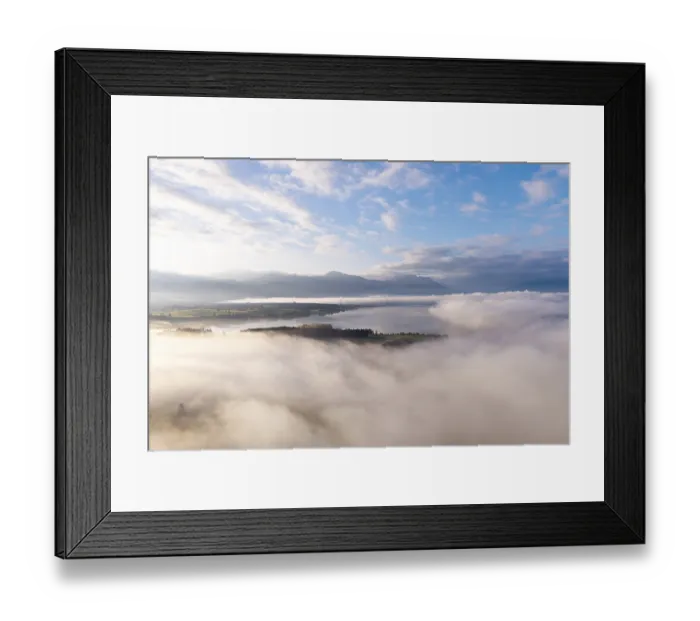 Framed Print : Morning fog hovers over Lake Forggensee with mountains in the background