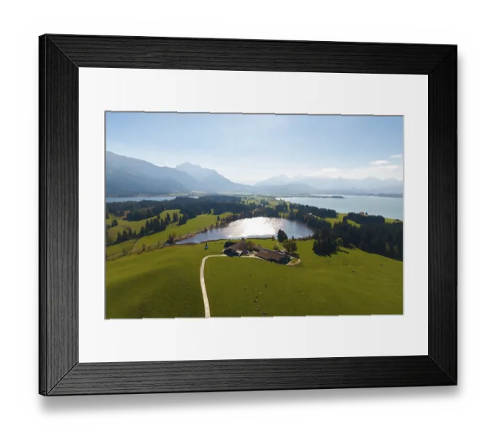 Framed Print : Large-scale view of hilly, wooded landscape with Hegratsried Lake and mountains
