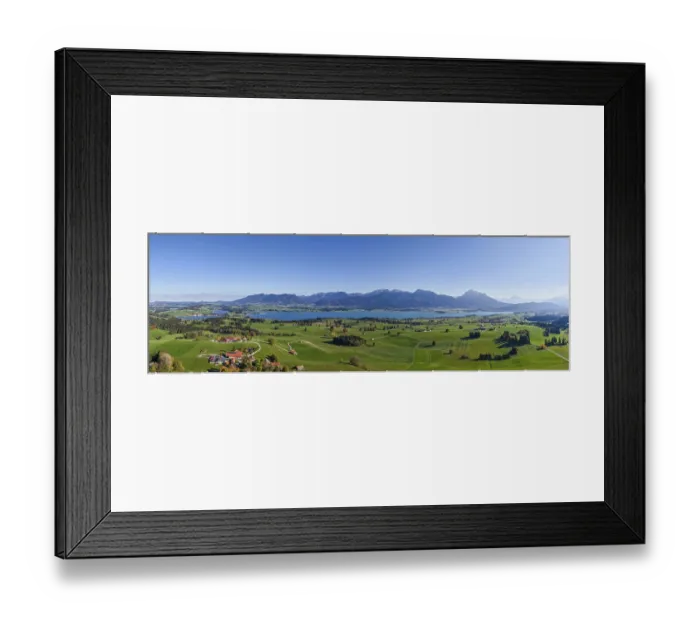 Framed Print : Panoramic view of a vast landscape with Lake Forggensee and mountains on the horizon Framed Print : Panoramic view of a vast landscape with Lake Forggensee and mountains on the horizon