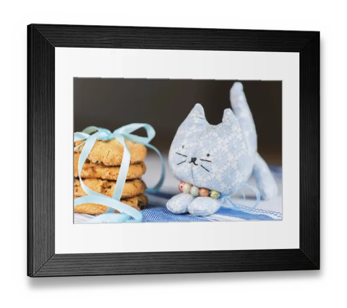 Framed Print : Homemade puppet, a cat and cookie on tablecloth