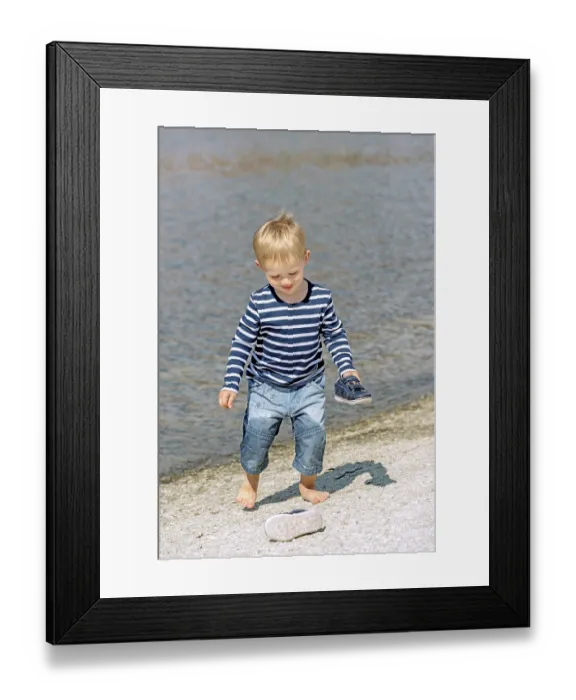 Framed Print : Little preschool boy playing on shore outdoors