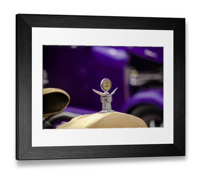 Framed Print : A close-up of a vintage car hood ornament with a distinct design