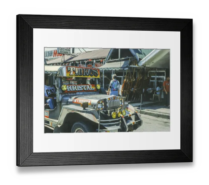 Framed Print : Jeepney minibus in front of a restaurant with skewered suckling pig