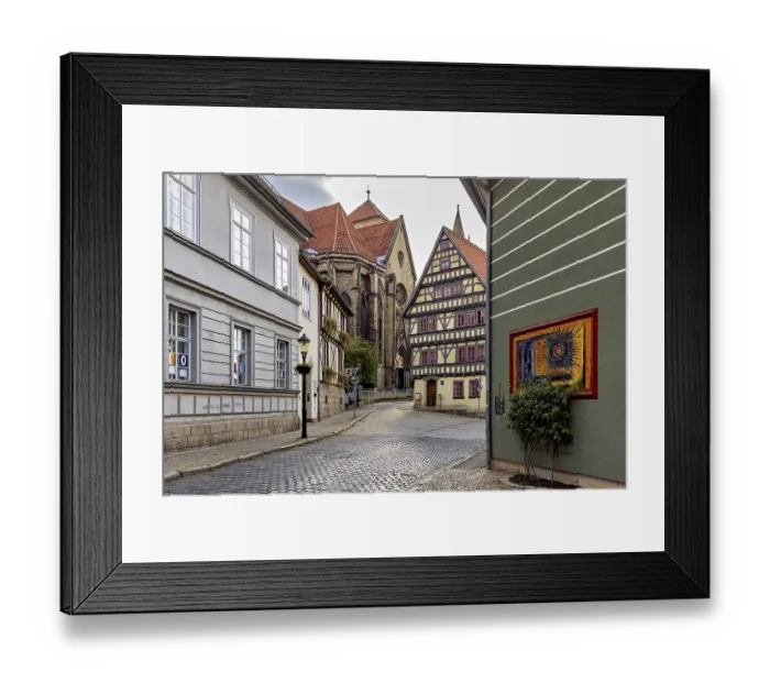 Framed Print : Atmospheric alley with half-timbered houses