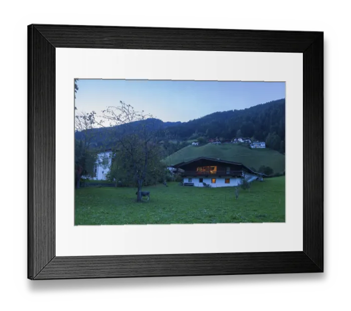 Framed Print : Houses, meadow and mountains with holiday home at dusk