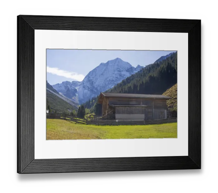 Framed Print : Snowy mountain hawk with cattle shed on the Pinnisalm in autumn