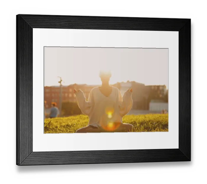 Framed Print : Portrait of young millenial european short haired woman doing yoga lotus asana on green grass meadow summer park sunset Framed Print : Portrait of young millenial european short haired woman doing yoga lotus asana on green grass meadow summer park sunset