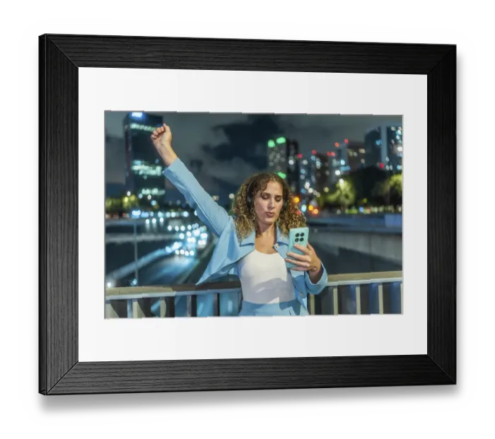Framed Print : Young woman with curly hair wearing headphones and an elegant blue outfit Framed Print : Young woman with curly hair wearing headphones and an elegant blue outfit