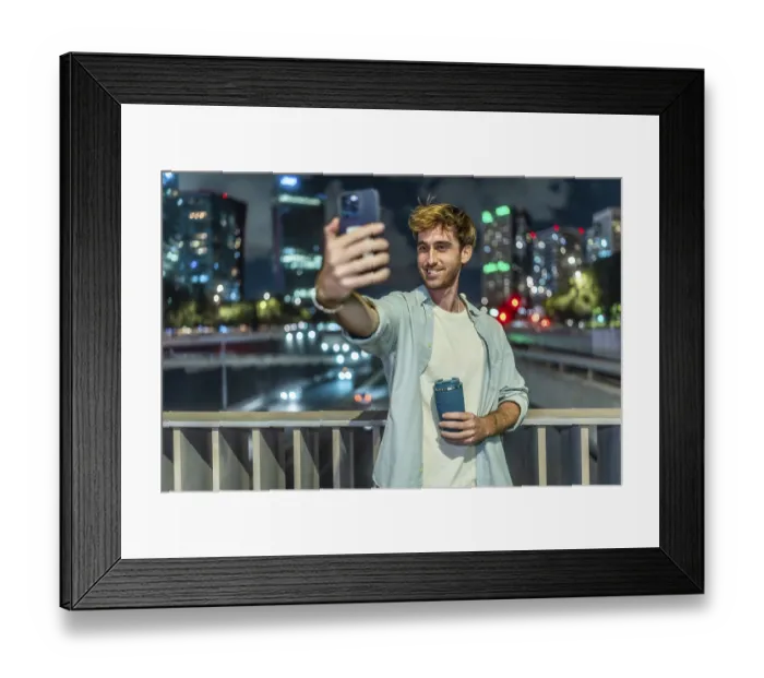 Framed Print : Young man standing on a bridge Framed Print : Young man standing on a bridge