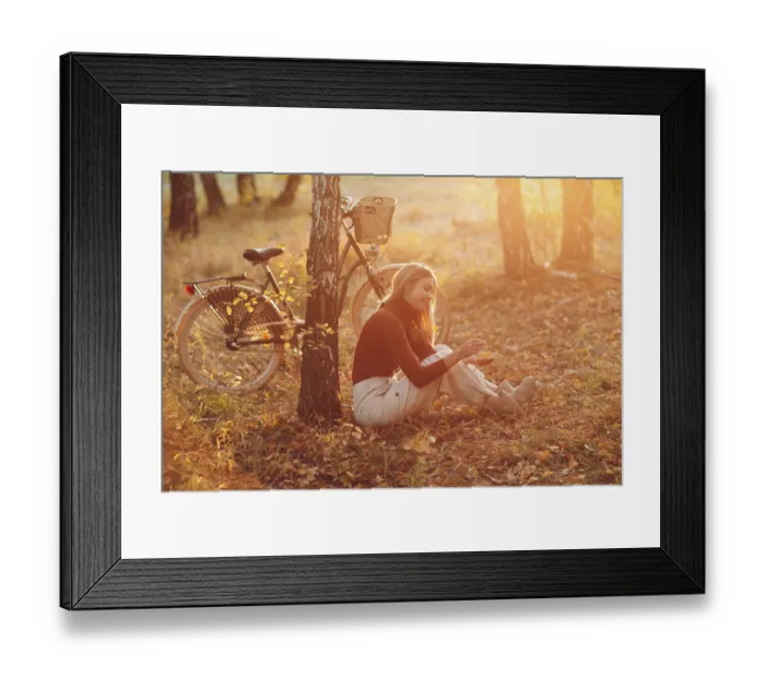 Framed Print : Happy active young woman riding vintage bicycle in autumn park at sunset Framed Print : Happy active young woman riding vintage bicycle in autumn park at sunset