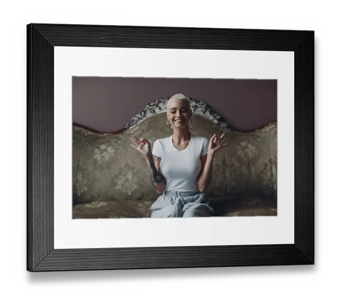 Framed Print : Millenial young woman with short blonde hair portrait sitting and meditate with ok sign mudra on vintage sofa indoors Framed Print : Millenial young woman with short blonde hair portrait sitting and meditate with ok sign mudra on vintage sofa indoors